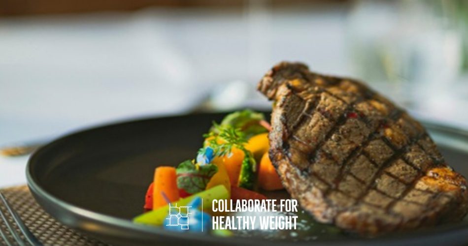 Grilled steak with vegetables on a black plate, foods high in alanine