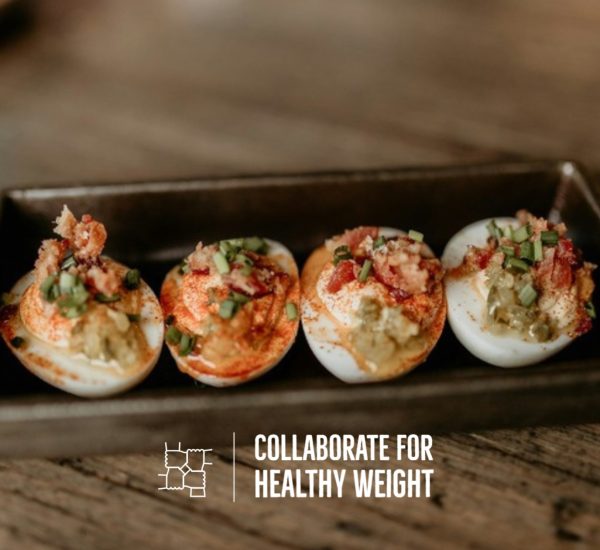 Tray of deviled eggs for a high-protein Halloween snack table