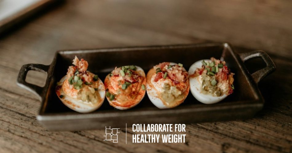 Tray of deviled eggs for a high-protein Halloween snack table