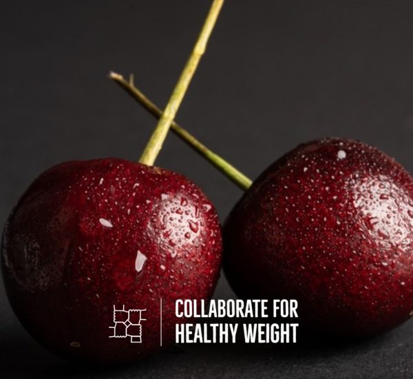 Fresh cherries with water droplets on a dark background