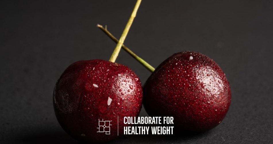Fresh cherries with water droplets on a dark background