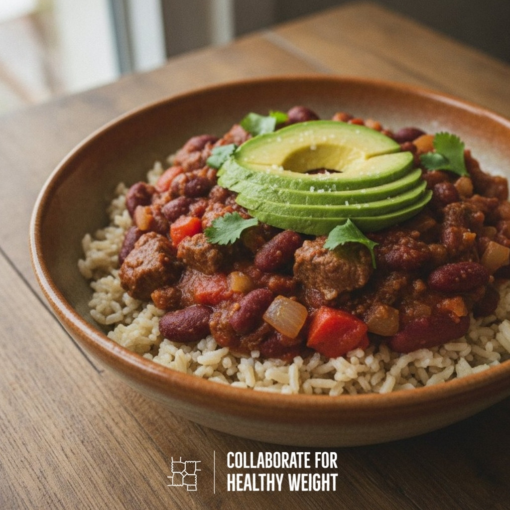 Beef and kidney bean chili over brown rice with sliced avocado